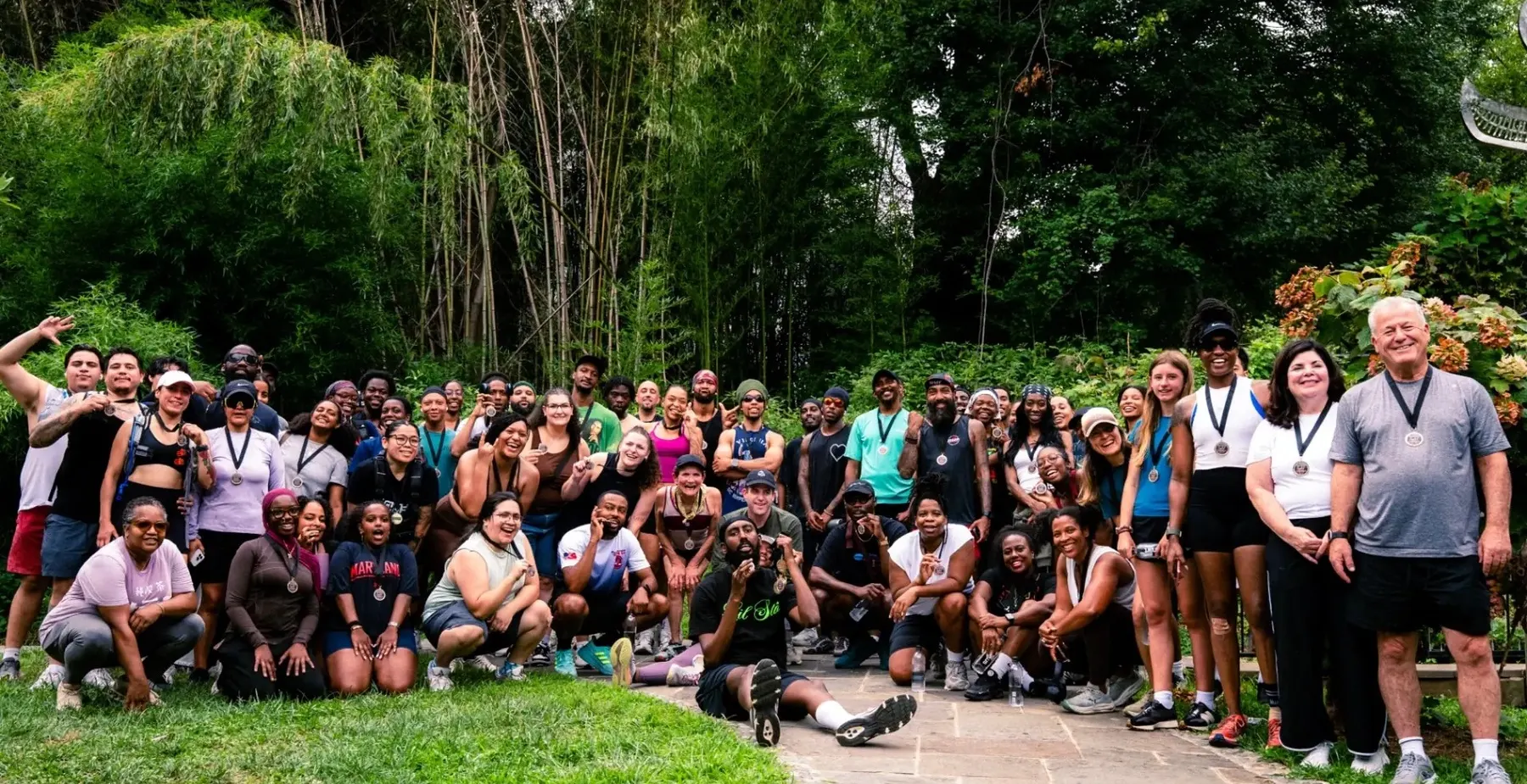 A large GRYT community group photo outdoors after a run
